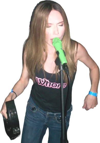 Rose Thorne singing with a tambourine